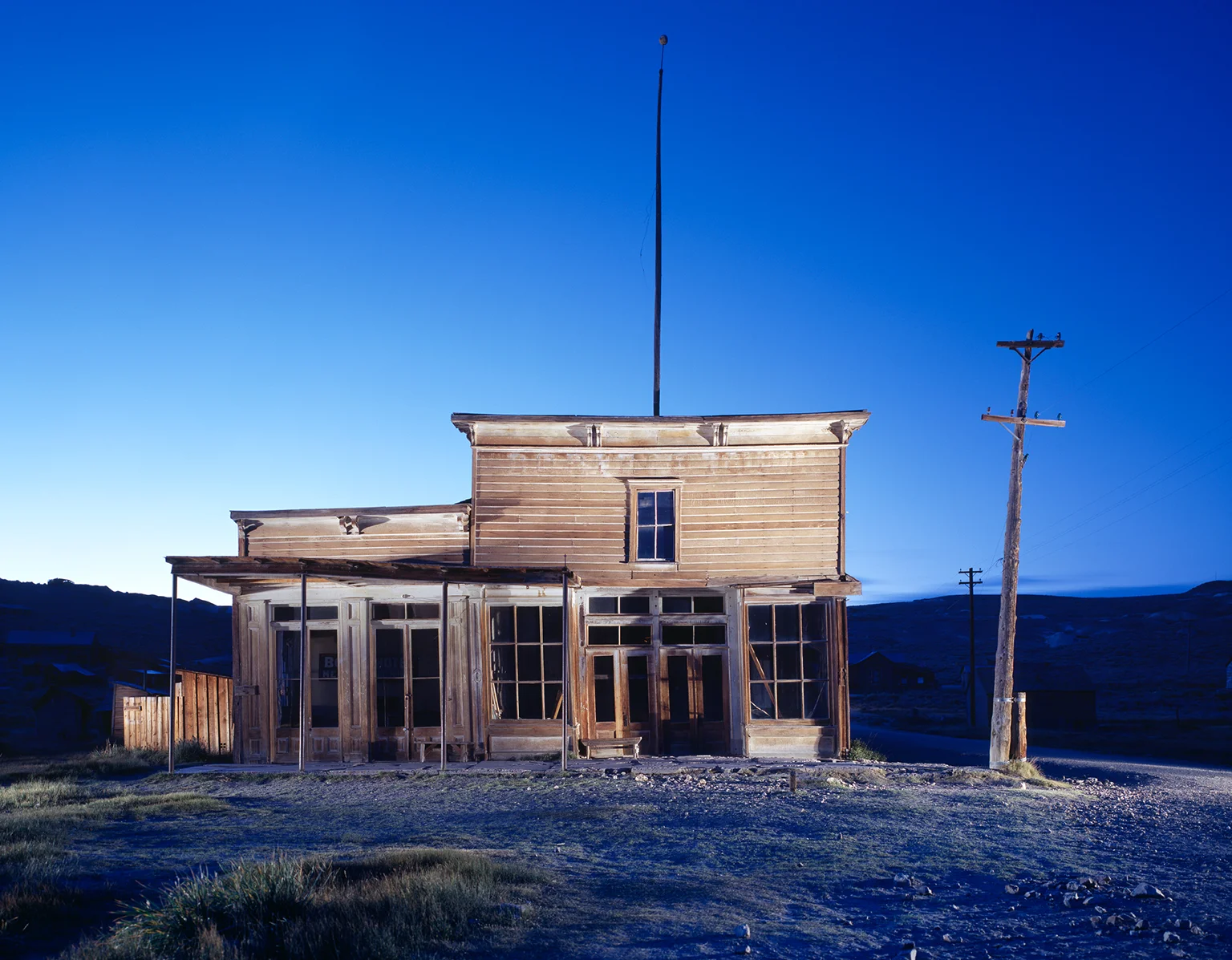 The wooden buildings of the Wheaton Hollis Hotel at dawn in the ghost town of Bodie