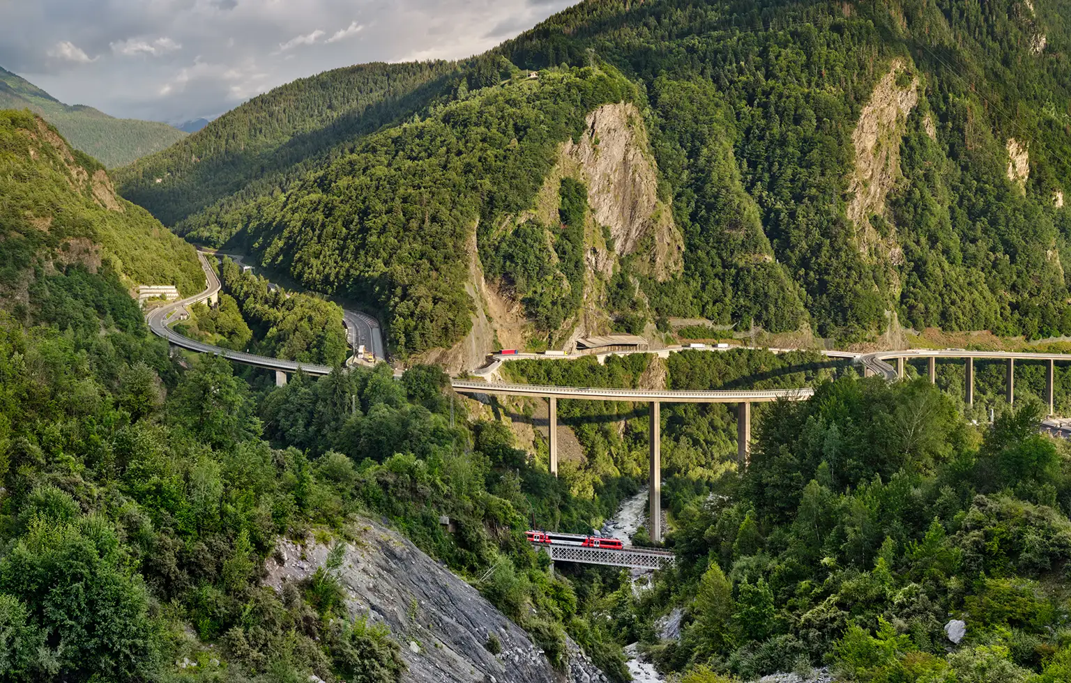 A Mont Blanc Express train in the Arve Valley near Chedde, below the Viaduc des Egratz bridge
